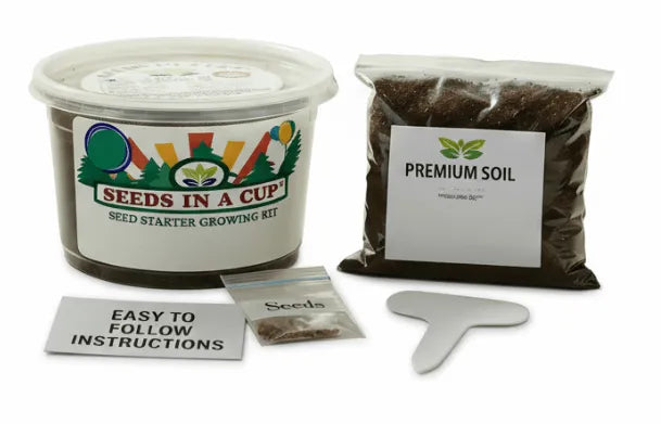 Seeds in a Cup seed starter growing kit with premium soil, trowel, and seeds on a white background
